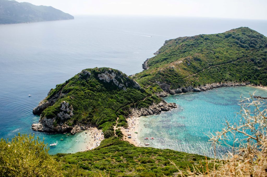View over Porto Timoni Beach from the viewpoint hike. Hiking is a great way to explore the island of Corfu in autumn's cooler temperatures.