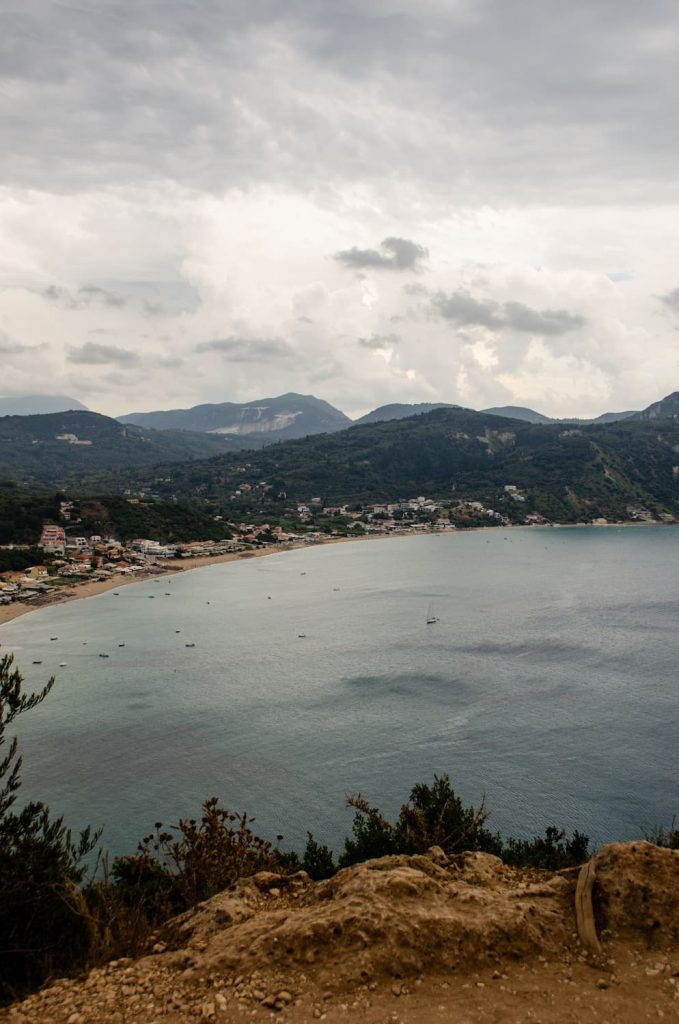 A stormy, cloudy day in Corfu overlooking Agios Georgious Beach from the Porto Timoni Hike. Visiting Corfu in October is perfect for hiking in cooler temperatures.